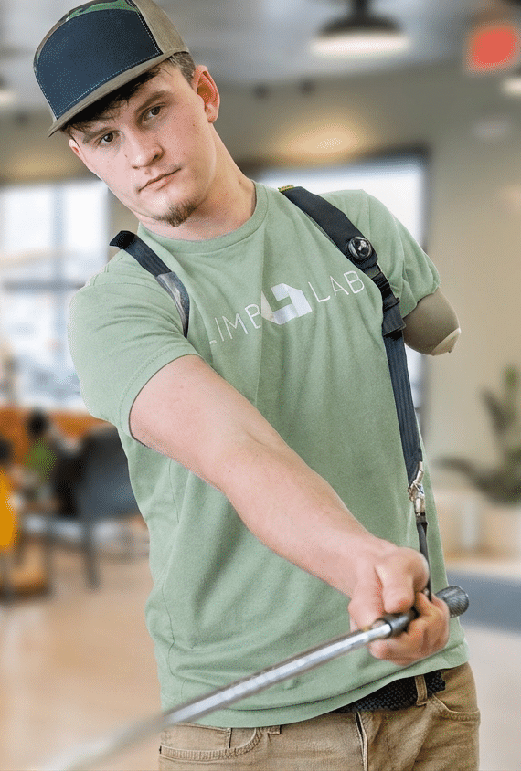 Limb Lab patient using custom golf prosthetic in Des Moines, IA.