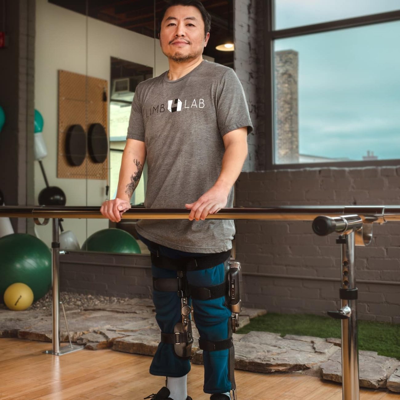 Man posing with Knee-Ankle-Foot-Orthotics
